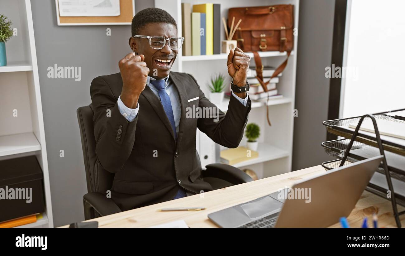 Black entrepreneur celebrating success computer hi-res stock ...
