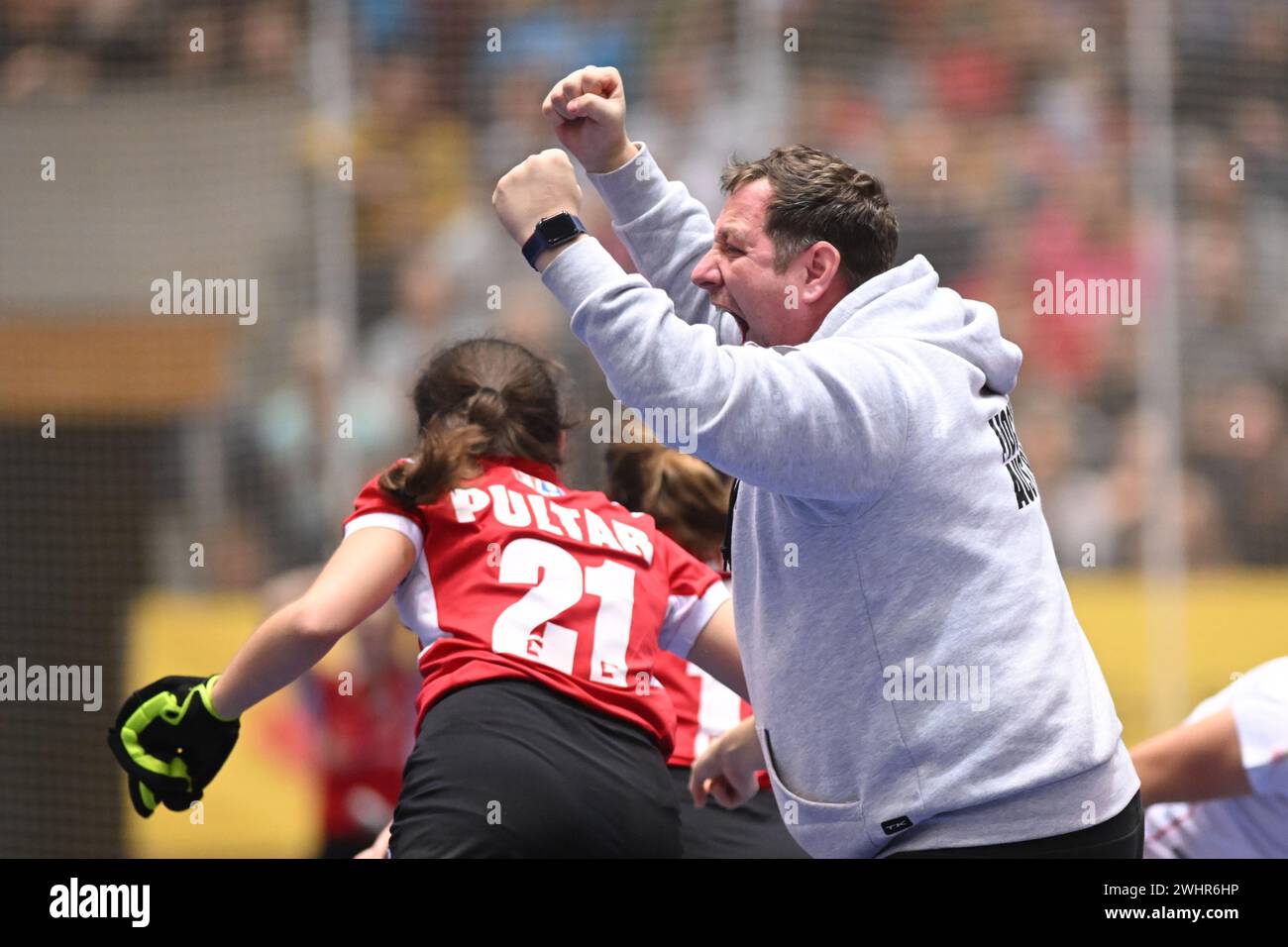 Berlin, Germany. 11th Feb, 2024. Hockey/hall, women, European Championship, Austria - Spain, final round, match for third place: Sven Lindemann, Austria's coach of the women's national field hockey team, cheers next to Marianne Pultar. Credit: Sebastian Christoph Gollnow/dpa/Alamy Live News Stock Photo