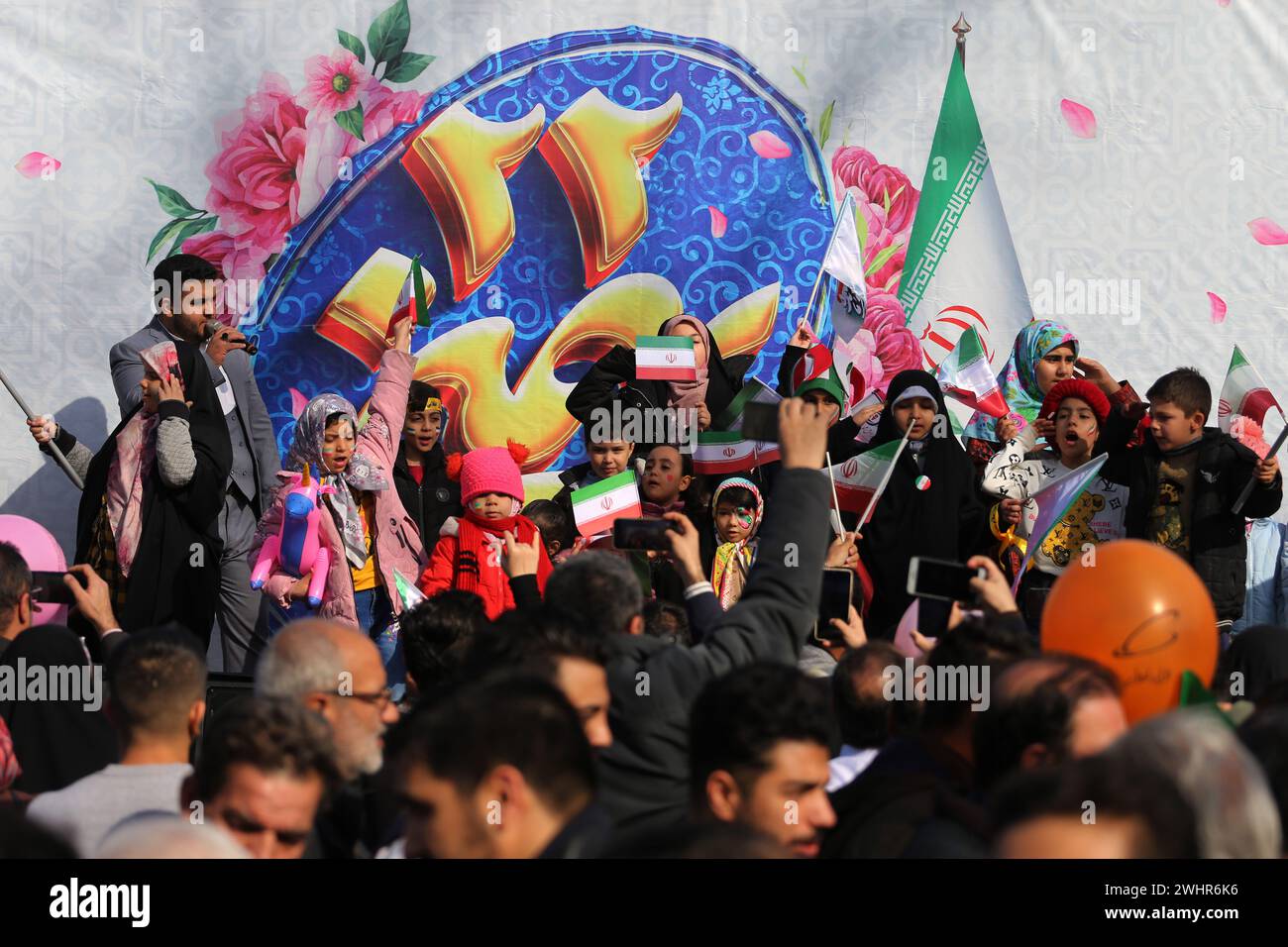 Tehran, Iran. 11th Feb, 2024. Iranian school boys and girls performe while gathering to mark the 45th anniversary of the Islamic Revolution in Tehran. Iran marked on 11 February 2024 the 45th anniversary of the 1979 Islamic Revolution amid tensions gripping the wider Middle East over Israel's continued war on Hamas in the Gaza Strip. Iranian president Ebrahim Raisi condemned arch-foe Israel and demanded it be expelled from the United Nations. (Credit Image: © Rouzbeh Fouladi/ZUMA Press Wire) EDITORIAL USAGE ONLY! Not for Commercial USAGE! Stock Photo