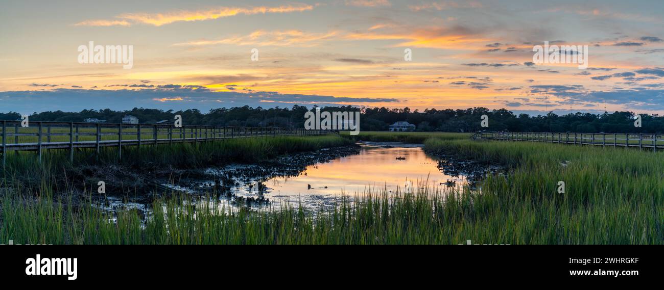 Panorama landscape view of tidal beds and marshlands in Pawleys Island in South Carolina at sunset Stock Photo
