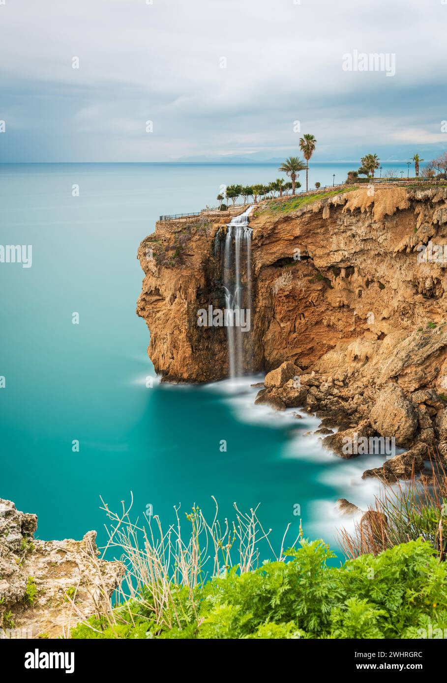 Long exposure image of the waterfall falling from the cliffs into the sea in Fener, Antalya Stock Photo