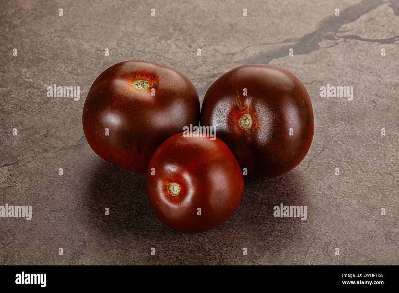 Organic natural juicy ripe Kumato tomato Stock Photo Alamy