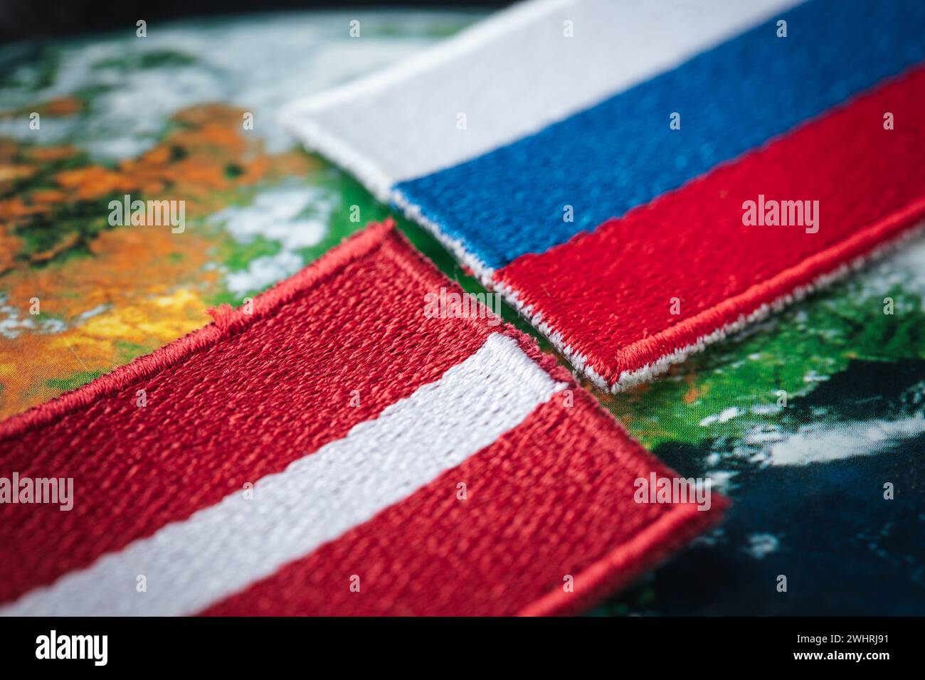 Flags of Latvia and Russia, Symbols of countries, Concept, Mutual relations, common border, Russian minority in Latvia Stock Photo