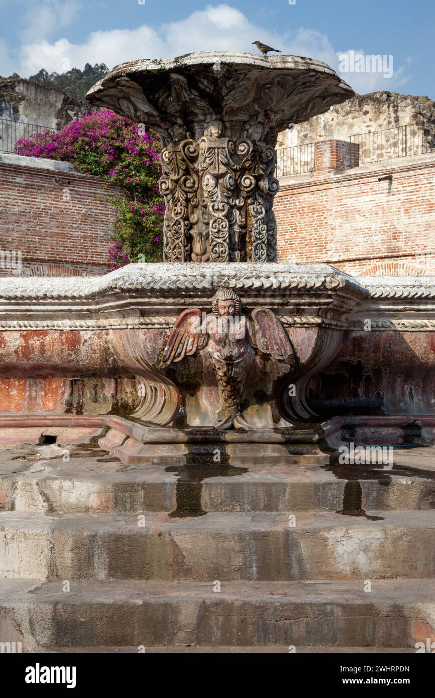 Antigua, Guatemala.  Courtyard and Fountain (Fuente de Pescados) of La Merced Church.  Fountain constructed 18th. century, restored 1944. Stock Photo