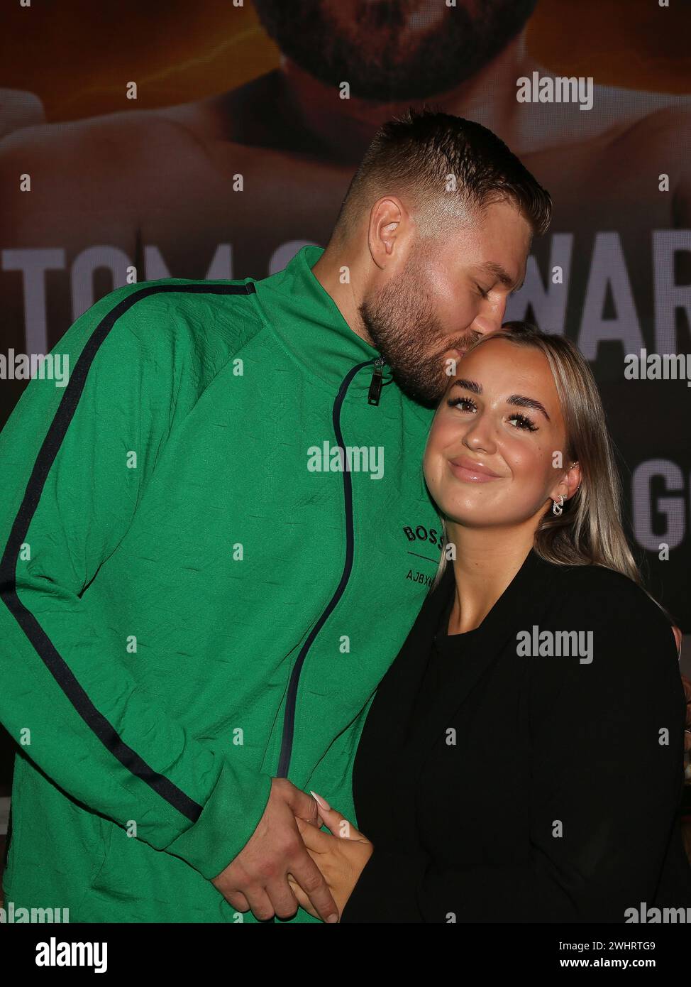 Boxer Tom Schwarz from the Magdeburg boxing stable Fides Sports kisses his wife Frederike at the press conference for THE SHOW M Stock Photo