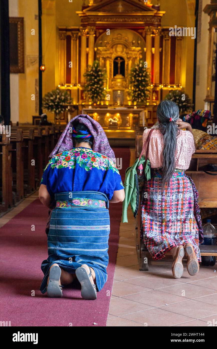 Antigua, Guatemala.  Women Kneeling in Church of San Jose, formerly Santiago. Stock Photo