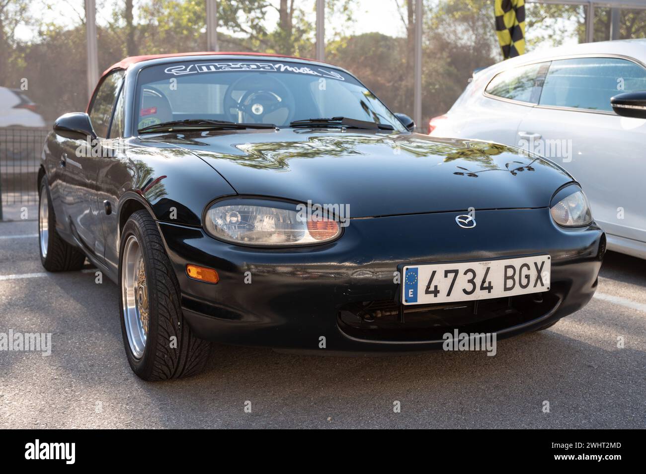 Front view of a black Japanese two-seater sports car, Mazda MX-5 Miata NB Stock Photo
