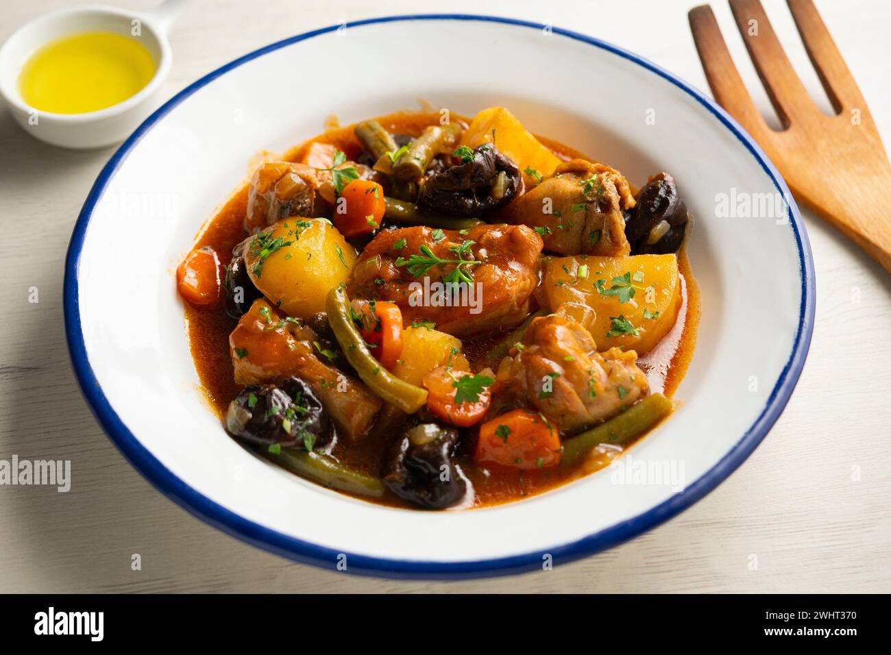 Stewed rabbit with potatoes, green beans, carrots and tomato Stock ...