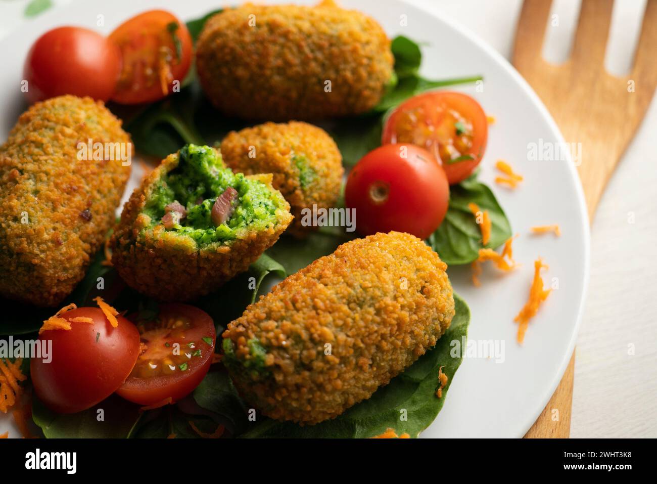 Spanish croquettes made with bechamel sauce and stuffed with ham and