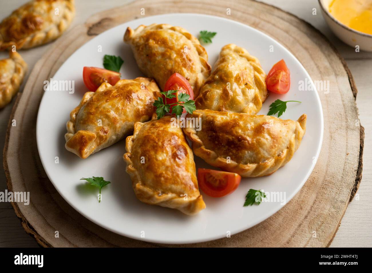 Baking delicious Argentine empanadas with chicken and vegetables. Stock Photo