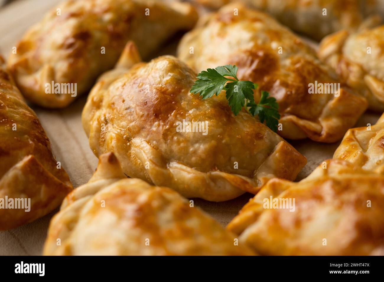 Baking delicious Argentine empanadas with chicken and vegetables. Stock Photo