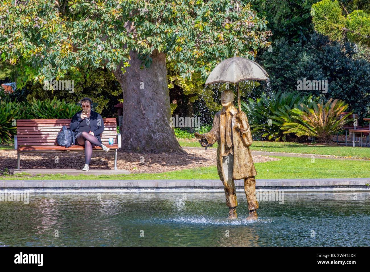 Melbourne Australia   Oct. 16, 2023: Rain Man stands in an ornamental pond in St. Kilda botanic gardens. The solar-powered  statue, designed by Corey Stock Photo