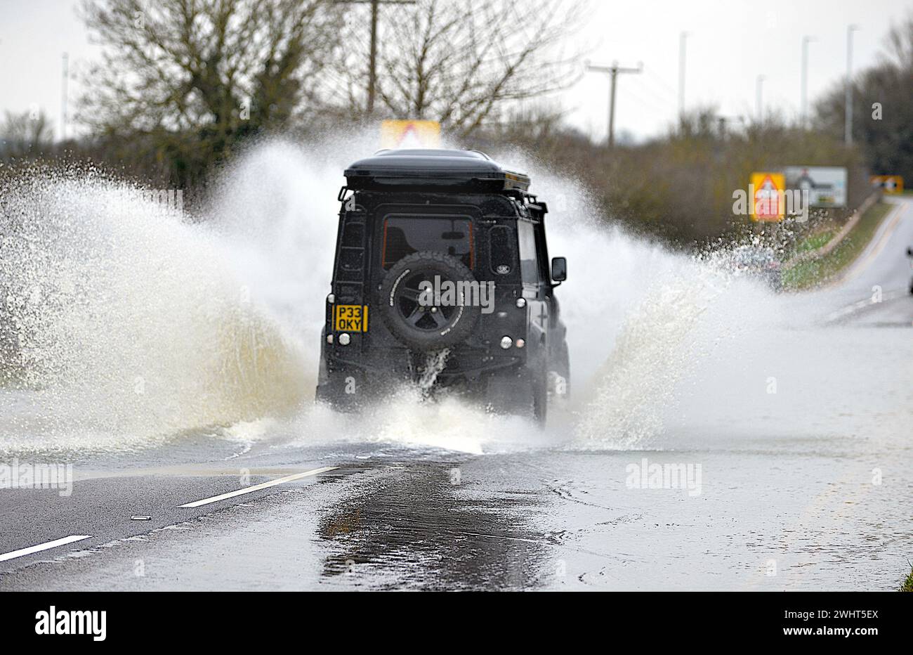 Mountsorrel, Leicestershire, UK, 11th February 2024.  Vehicles negotiate floodwater on Granite Way, Mountsorrel, Leicestershire. Leicestershire still struggles to recover from the rains with widespread flooding. Credit: Chris De Bretton-Gordon / Alamy Live News. Stock Photo