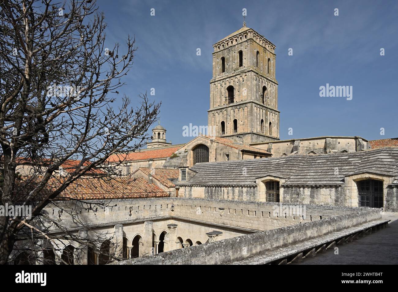 Saint-Trophime cloister and the bell tower of Saint-Trophime Cathedral in Arles, Provence, France Stock Photo