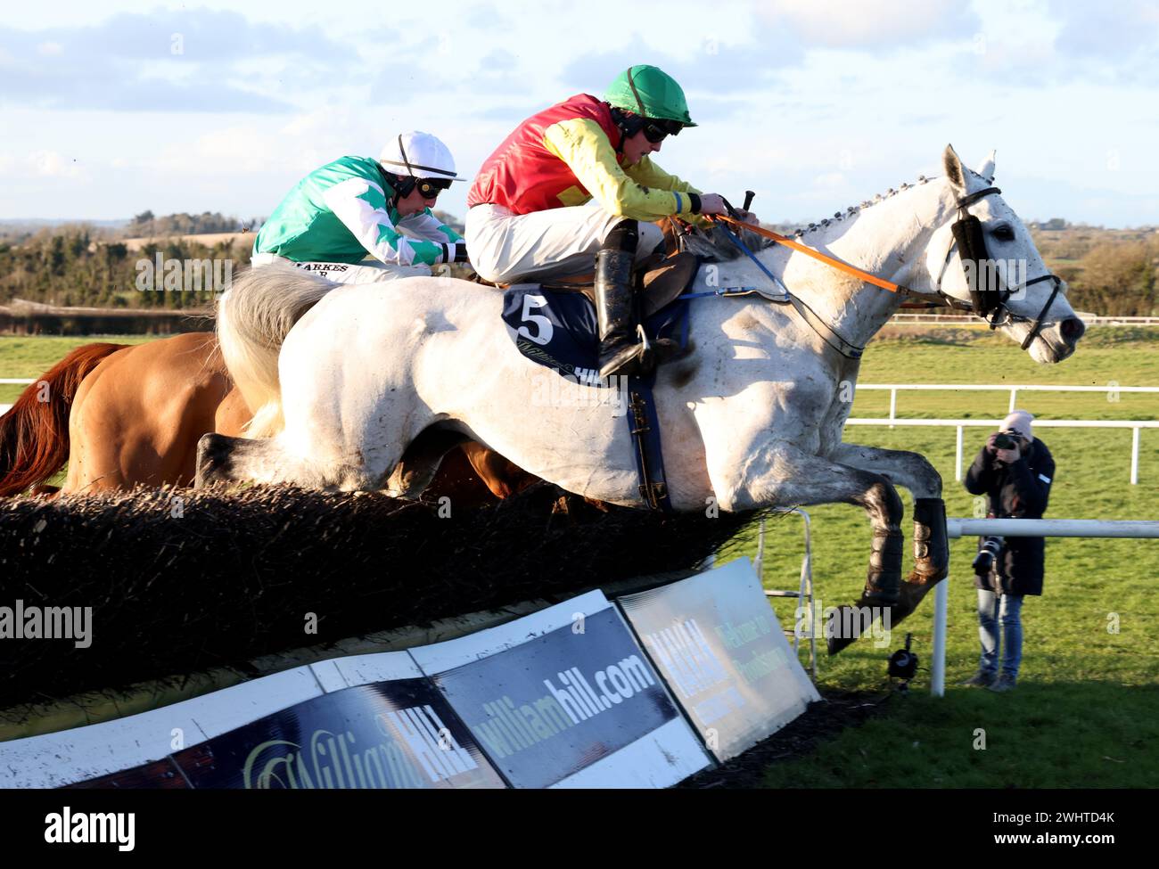 Young Dev (right) Ridden By Jockey Daniel King Jumps The Last Fence On ...