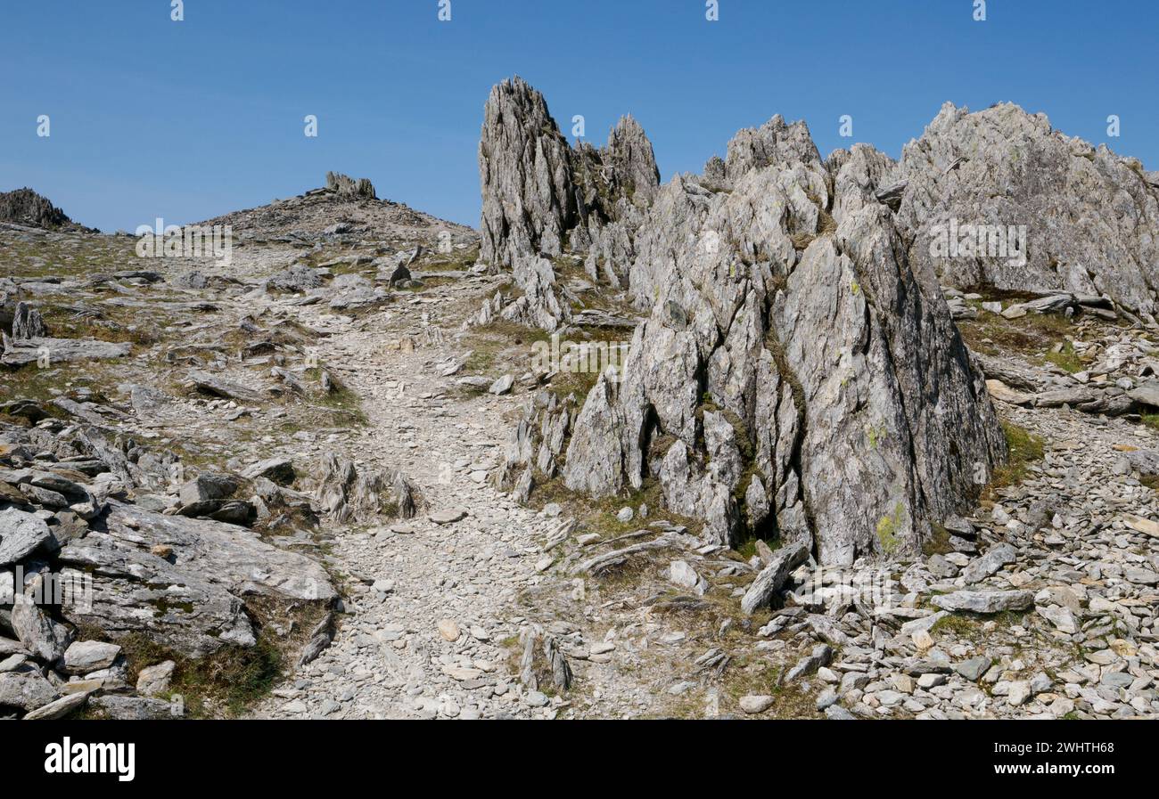 Jagged Rhyolitic rock pinnacles on the approach to the summit of Glyder Fawr in Snowdonia Eryri North Wales Stock Photo