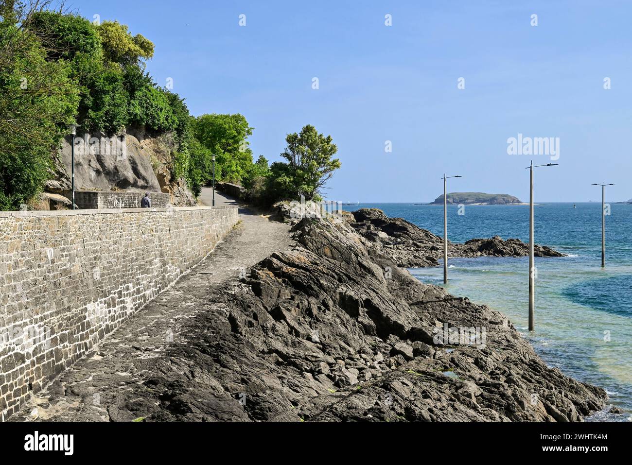 Fortified coast with paths on the rocky shore in Dinard, Ille-et-Vilaine, Brittany, France Stock Photo