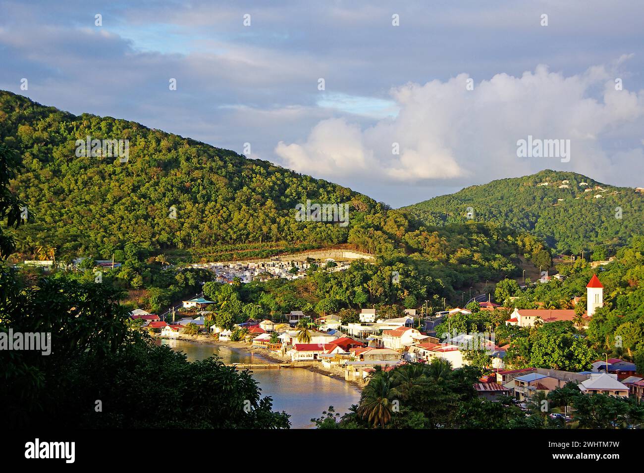 Caribbean, French Antilles, Guadeloupe, Basse-Terre, View of the village Deshaies with harbour Stock Photo