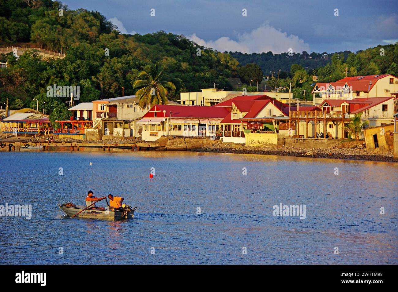 Caribbean, French Antilles, Guadeloupe, Basse-Terre, View of the village of Deshaies with harbour basin Stock Photo