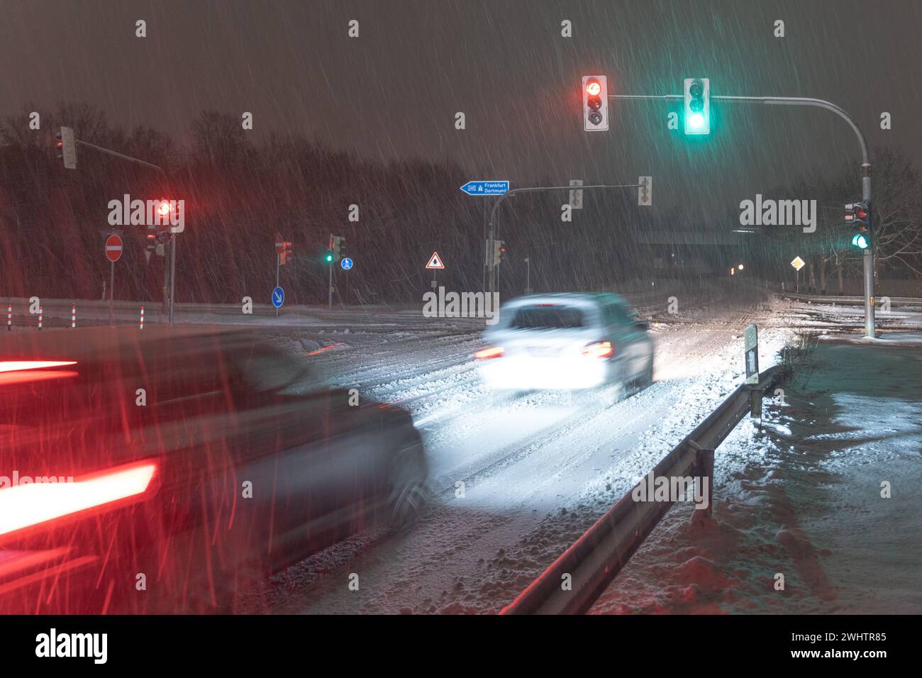 Red and green car lights amid traffic movement Stock Photo