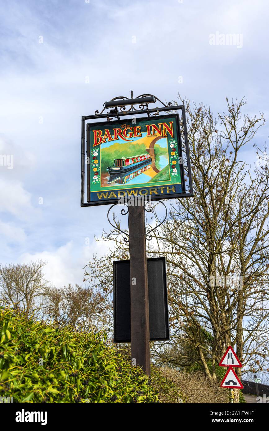 Sign for the The Barge Inn which is situated beside the Kennet and Avon Canal at Seend Cleeve, Wiltshire, England, UK Stock Photo
