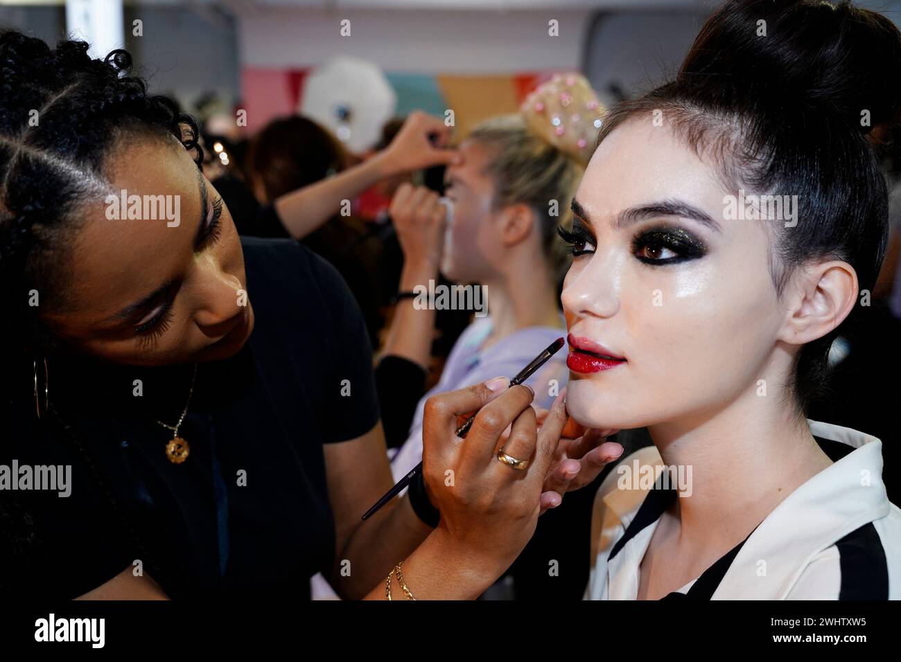 The Alice and Olivia Fall 2024 Presentation, make up by Two Faced, held