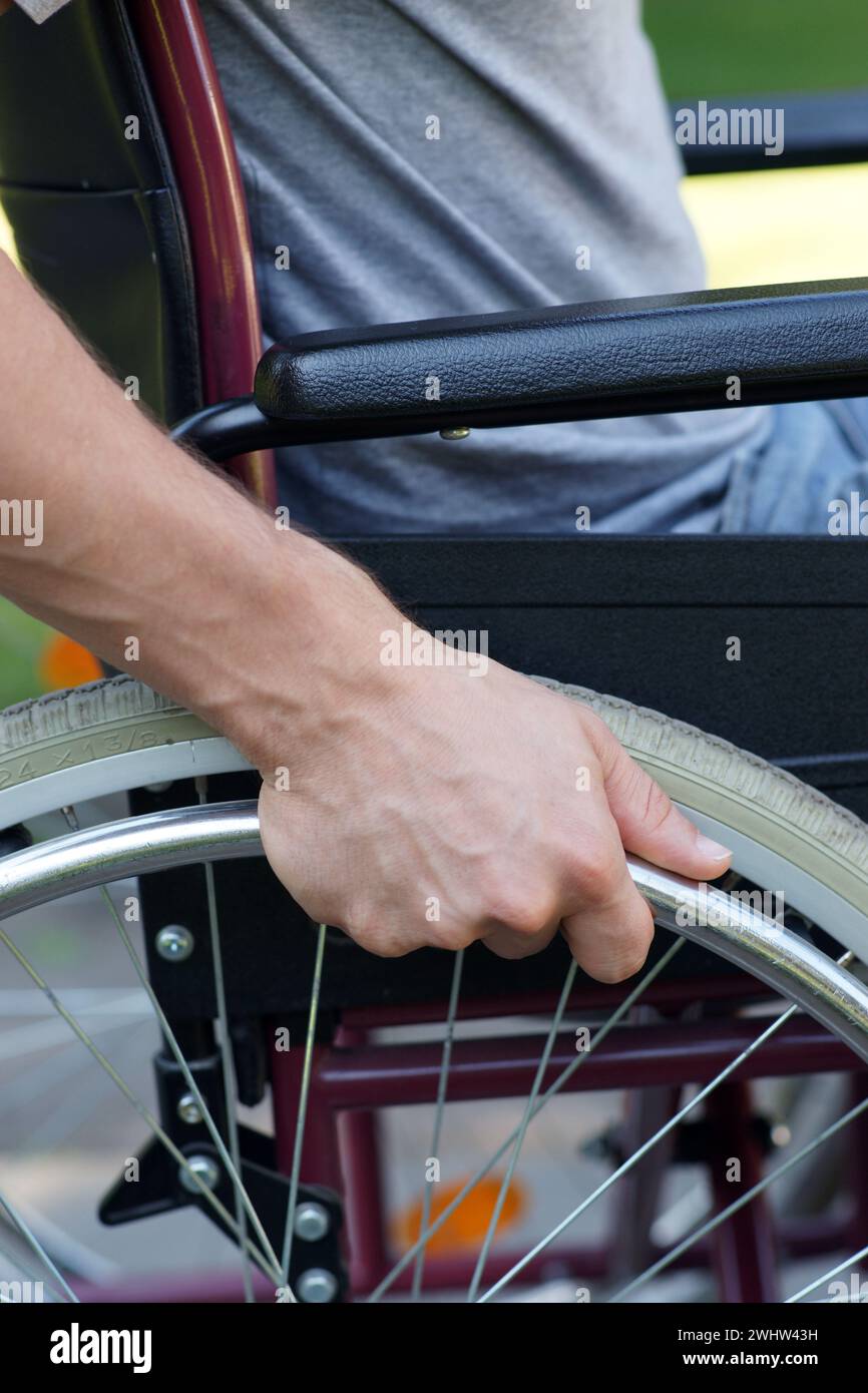 People Using Wheel Disabled man using his wheel chair in park closeup Stock Photo - Alamy