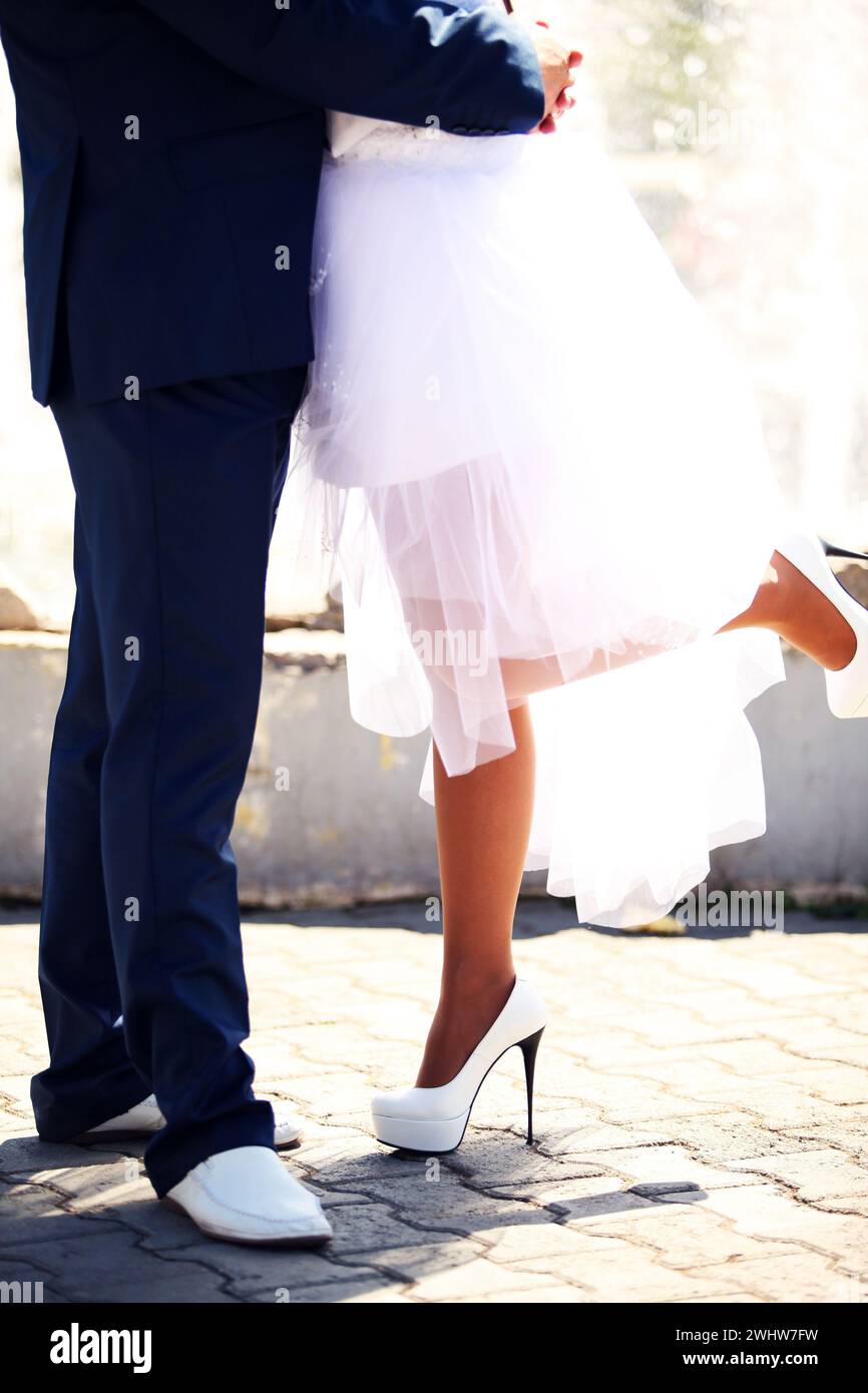 Happy bride and groom walking together Stock Photo - Alamy