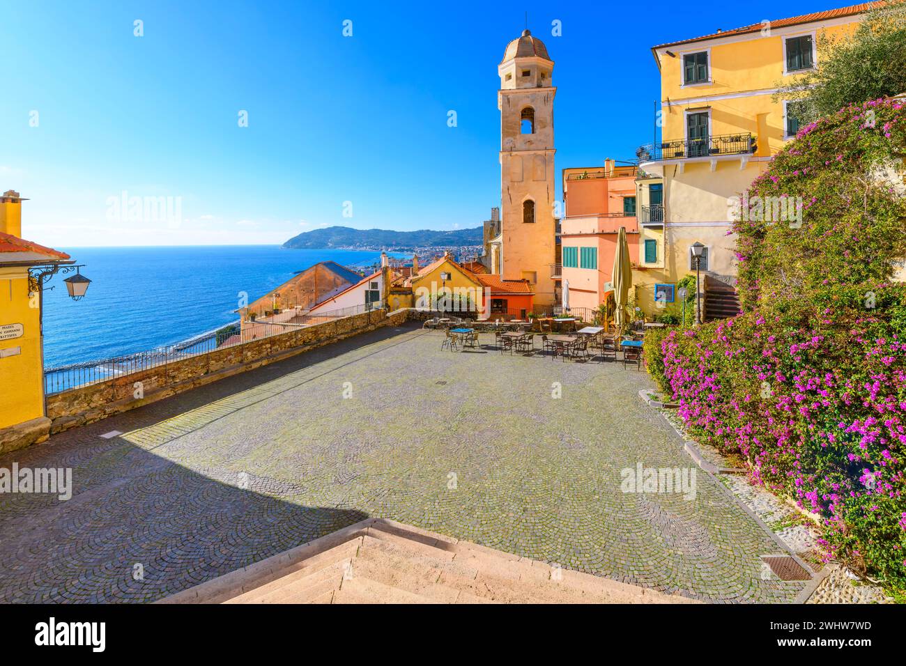 View from the steps of the Church of San Giovanni Battista of the Oratorio di Santa Caterina Tower, old town and Mediterranean from the Ligurian town Stock Photo