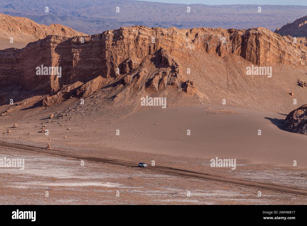 A bright red rock formations in the middle of the Valley of the Moon, Valle de la Luna, within the Atacama Desert in northern Chile. Stock Photo