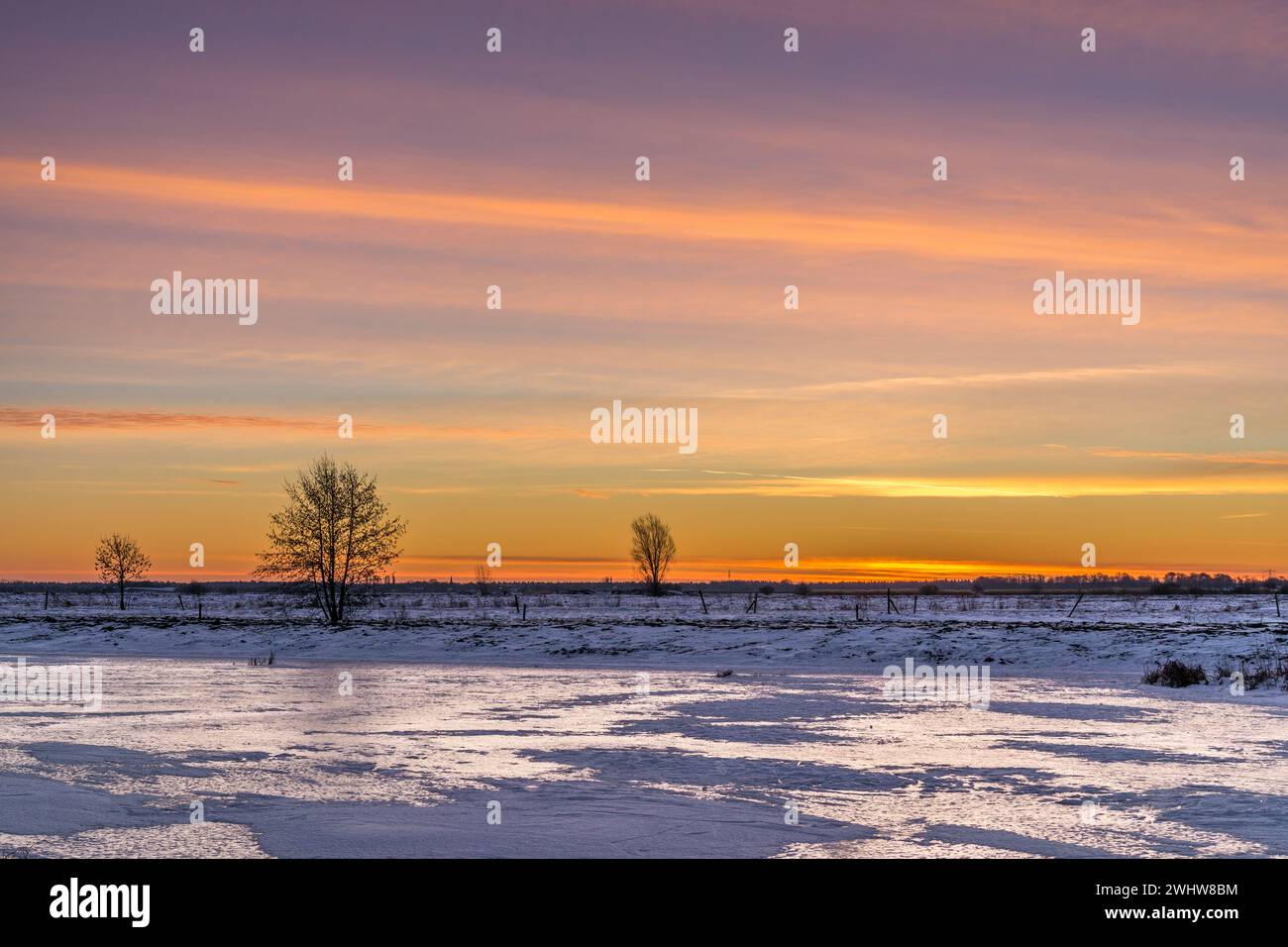 Beautiful sunrise over a frozen landscape in the middle of winter Stock ...