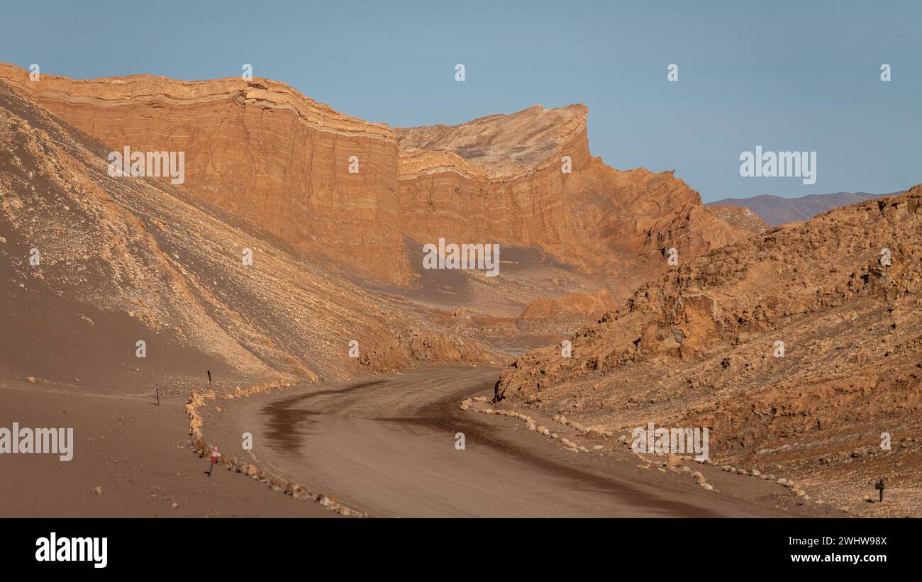 Towering, bright red rock formations in the middle of the Valley of the Moon, Valle de la Luna, within the Atacama Desert in northern Chile. Stock Photo