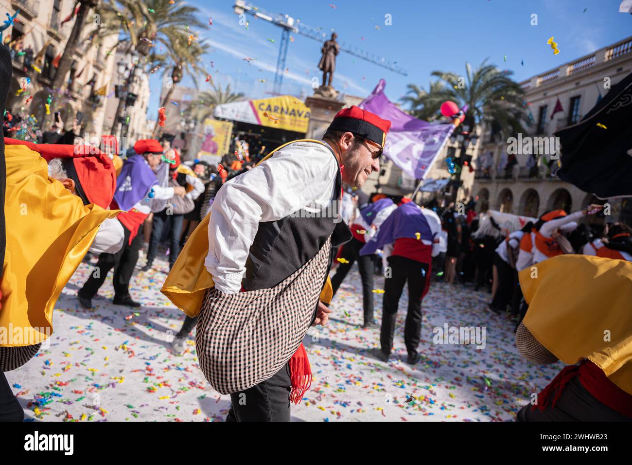 People are celebrating the traditional candy war, declared a Heritage Festival of National Interest, in Vilanova i la Geltru, Spain, on February 11, 2024. The celebration is underway as various groups and associations known as ''Comparsas'' are dancing and parading through the streets to the rhythm of a military march called ''El Turuta.'' The festivities will culminate in the town hall square with a pitched battle of candy. This year, the festival has attracted more than 10,000 participants. (Photo by Marc Asensio/NurPhoto)0 Credit: NurPhoto SRL/Alamy Live News Stock Photo