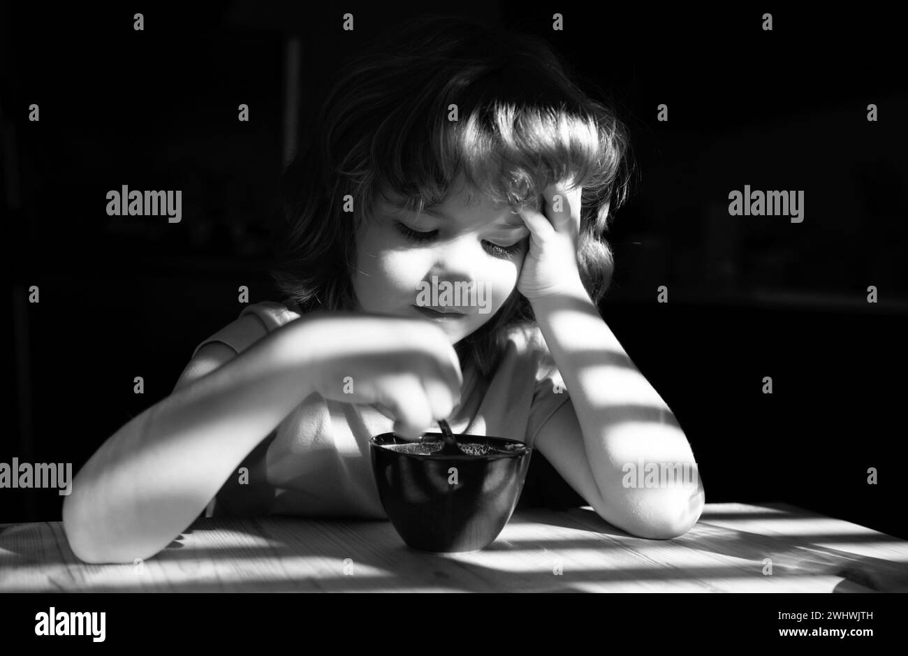 Healthy eating habits. Kids home food. Boy eats breakfast at kitchen