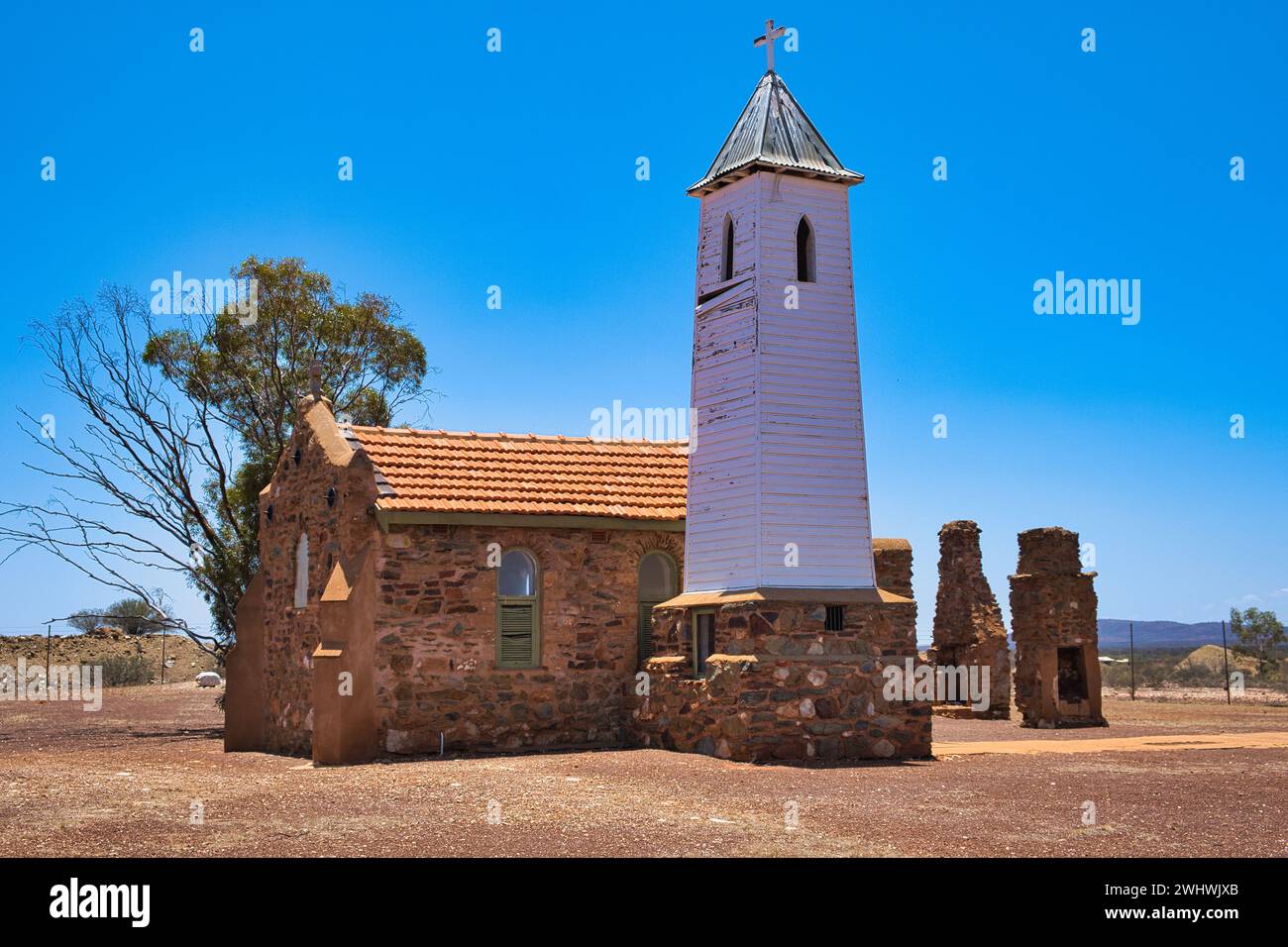 The quaint chapel of St Hyacinth (1922), by architect John Hawes, in Yalgoo, a gold mining town in Western Australia. Stone church, wooden bell tower Stock Photo