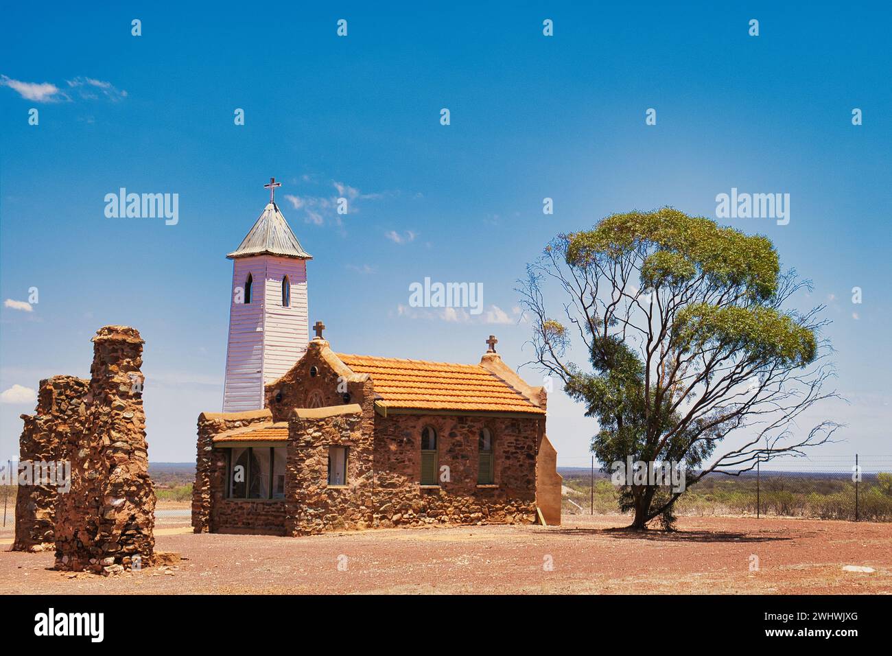 The quaint chapel of St Hyacinth (1922), by architect John Hawes, in Yalgoo, a gold mining town in Western Australia. Stone church, wooden bell tower Stock Photo