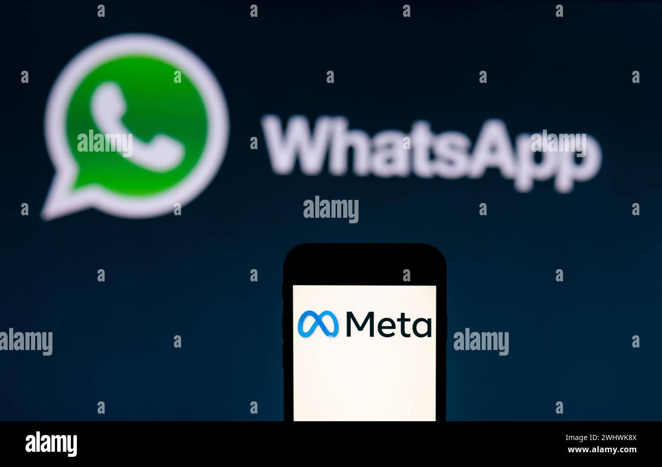 India. 12th Feb, 2024. In this photo illustration, the Meta logo is seen displayed on a mobile phone screen with WhatsApp logo in the background. (Photo by Idrees Abbas/SOPA Images/Sipa USA) *** Strictly for editorial news purposes only *** Credit: Sipa USA/Alamy Live News Stock Photo