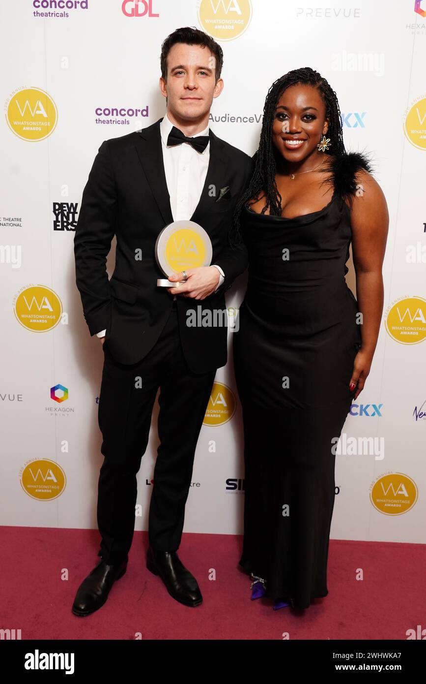 Luke Thompson, alongside presenter Onuorah, with his award for