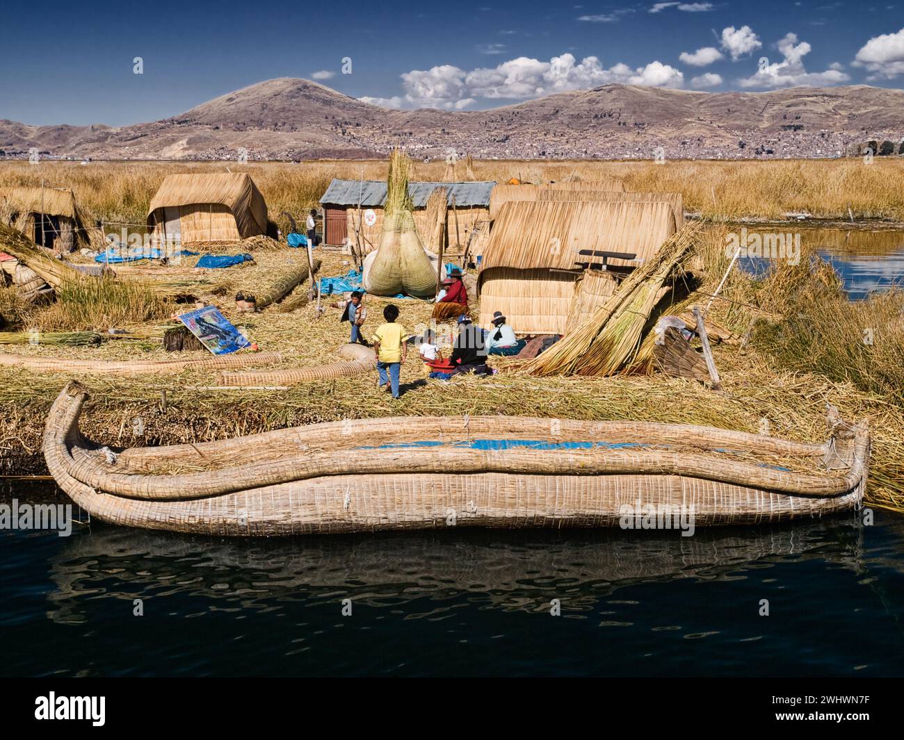Andean families with handmade boats and houses made of totora reed on ...