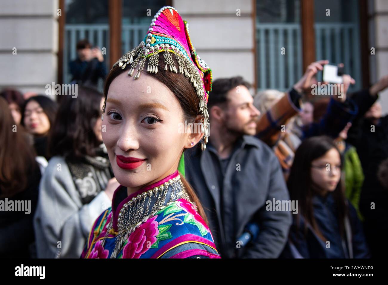 A performer in costume entertains spectators during the Chinese New