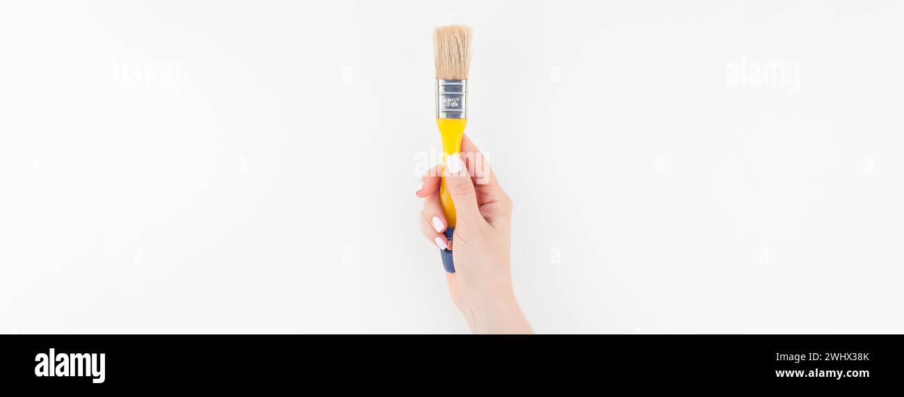Human hand holding paint brush hi-res stock photography and images - Alamy