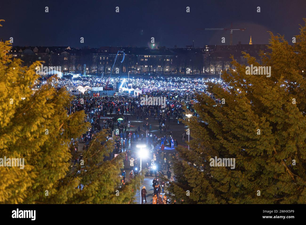 Munich, Germany. 11th Feb, 2024. Hundreds of thousands gathered on the Theresienwiese in Munich, Germany on February 11, 2024 for a so-called sea of lights against right-wing extremism, racism and the AfD. Participants illuminated the square in front of the Bavaria with flashlights, cell phone lights and lamps. The protest was motivated by a Correctiv research published this week on meetings in the Landhaus Adlon where deportation plans were elaborated. (Photo by Alexander Pohl/Sipa USA) Credit: Sipa USA/Alamy Live News Stock Photo