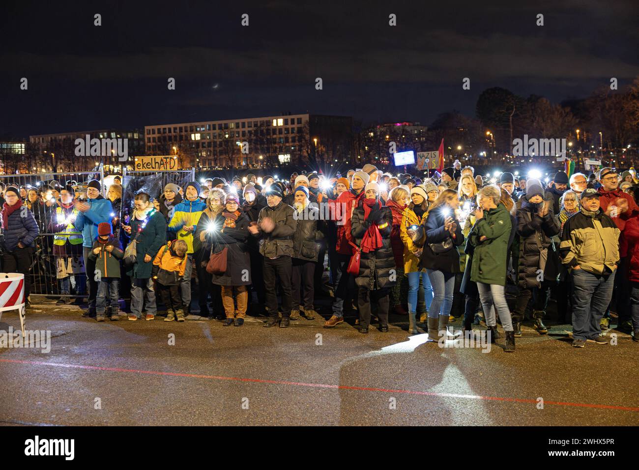 Munich, Germany. 11th Feb, 2024. Hundreds of thousands gathered on the Theresienwiese in Munich, Germany on February 11, 2024 for a so-called sea of lights against right-wing extremism, racism and the AfD. Participants illuminated the square in front of the Bavaria with flashlights, cell phone lights and lamps. The protest was motivated by a Correctiv research published this week on meetings in the Landhaus Adlon where deportation plans were elaborated. (Photo by Alexander Pohl/Sipa USA) Credit: Sipa USA/Alamy Live News Stock Photo