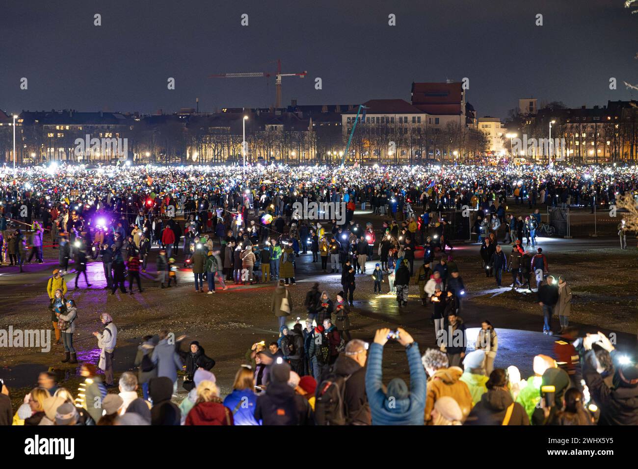 Munich, Germany. 11th Feb, 2024. Hundreds of thousands gathered on the Theresienwiese in Munich, Germany on February 11, 2024 for a so-called sea of lights against right-wing extremism, racism and the AfD. Participants illuminated the square in front of the Bavaria with flashlights, cell phone lights and lamps. The protest was motivated by a Correctiv research published this week on meetings in the Landhaus Adlon where deportation plans were elaborated. (Photo by Alexander Pohl/Sipa USA) Credit: Sipa USA/Alamy Live News Stock Photo