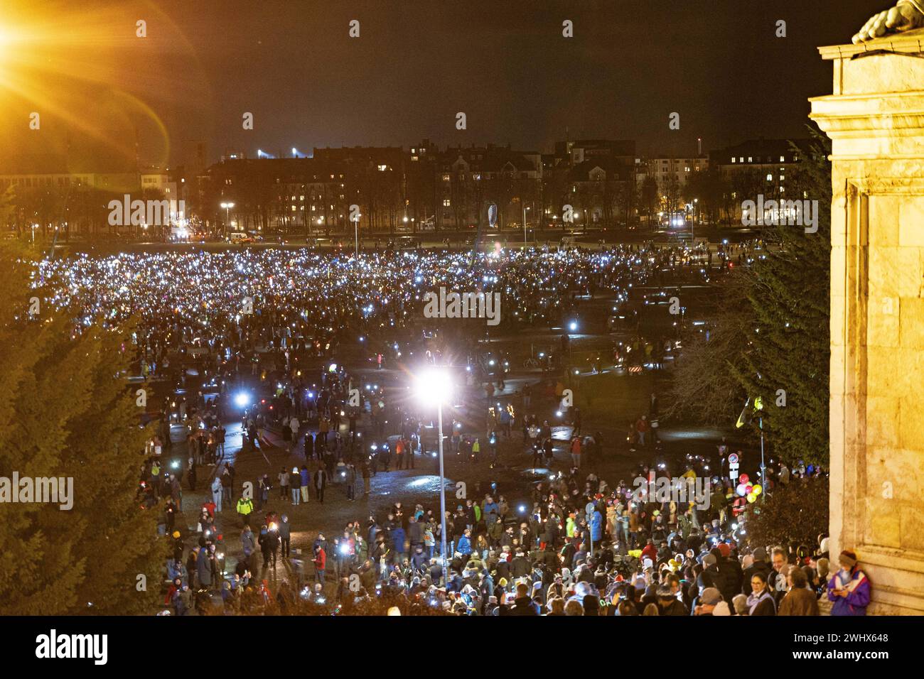 Munich, Germany. 11th Feb, 2024. Hundreds of thousands gathered on the Theresienwiese in Munich, Germany on February 11, 2024 for a so-called sea of lights against right-wing extremism, racism and the AfD. Participants illuminated the square in front of the Bavaria with flashlights, cell phone lights and lamps. The protest was motivated by a Correctiv research published this week on meetings in the Landhaus Adlon where deportation plans were elaborated. (Photo by Alexander Pohl/Sipa USA) Credit: Sipa USA/Alamy Live News Stock Photo
