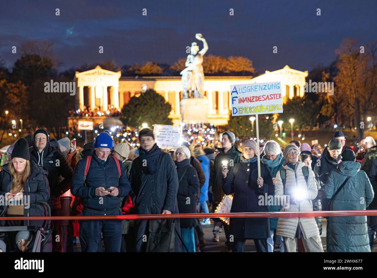 Munich, Germany. 11th Feb, 2024. Hundreds of thousands gathered on the Theresienwiese in Munich, Germany on February 11, 2024 for a so-called sea of lights against right-wing extremism, racism and the AfD. Participants illuminated the square in front of the Bavaria with flashlights, cell phone lights and lamps. The protest was motivated by a Correctiv research published this week on meetings in the Landhaus Adlon where deportation plans were elaborated. (Photo by Alexander Pohl/Sipa USA) Credit: Sipa USA/Alamy Live News Stock Photo