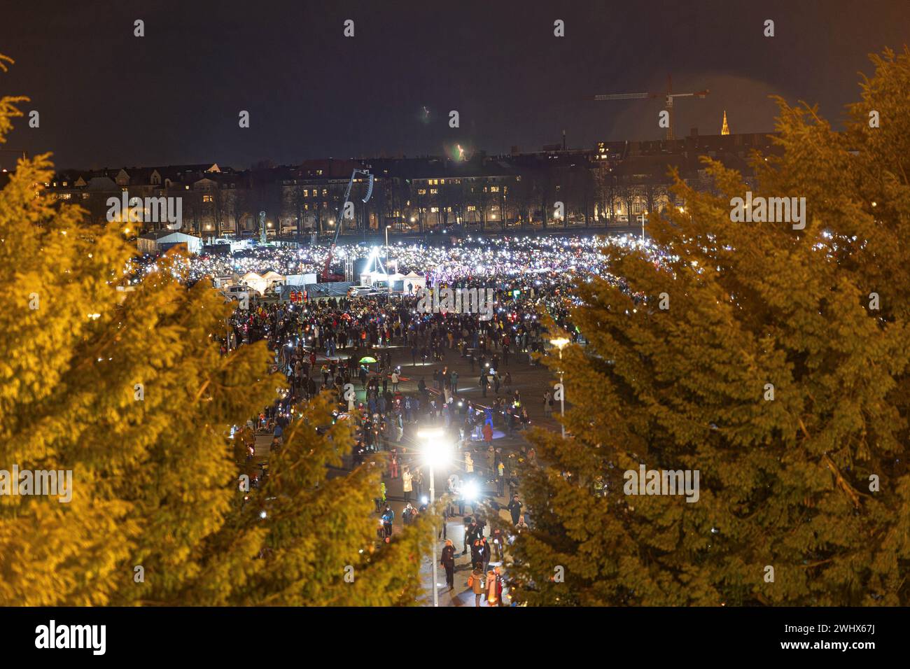 Munich, Germany. 11th Feb, 2024. Hundreds of thousands gathered on the Theresienwiese in Munich, Germany on February 11, 2024 for a so-called sea of lights against right-wing extremism, racism and the AfD. Participants illuminated the square in front of the Bavaria with flashlights, cell phone lights and lamps. The protest was motivated by a Correctiv research published this week on meetings in the Landhaus Adlon where deportation plans were elaborated. (Photo by Alexander Pohl/Sipa USA) Credit: Sipa USA/Alamy Live News Stock Photo