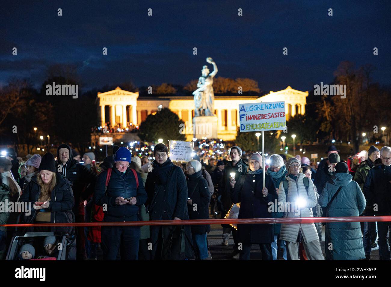 Munich, Germany. 11th Feb, 2024. Hundreds of thousands gathered on the Theresienwiese in Munich, Germany on February 11, 2024 for a so-called sea of lights against right-wing extremism, racism and the AfD. Participants illuminated the square in front of the Bavaria with flashlights, cell phone lights and lamps. The protest was motivated by a Correctiv research published this week on meetings in the Landhaus Adlon where deportation plans were elaborated. (Photo by Alexander Pohl/Sipa USA) Credit: Sipa USA/Alamy Live News Stock Photo