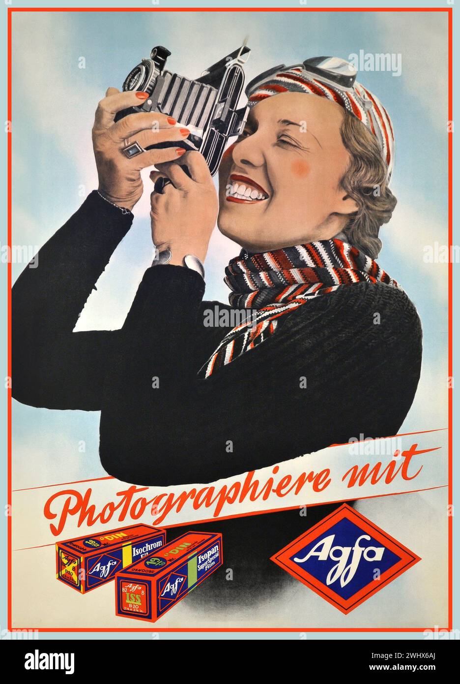 1930s Agfa Roll Film Bellows Camera and photographic film advertisement with stylish lady holding an Agfa film camera, looking through the collapsible viewfinder. 'PHOTOGRAPHY WITH....AGFA' Isochrome and Isopan Black and White film cartons feautured with Agfa logo.. Germany Stock Photo