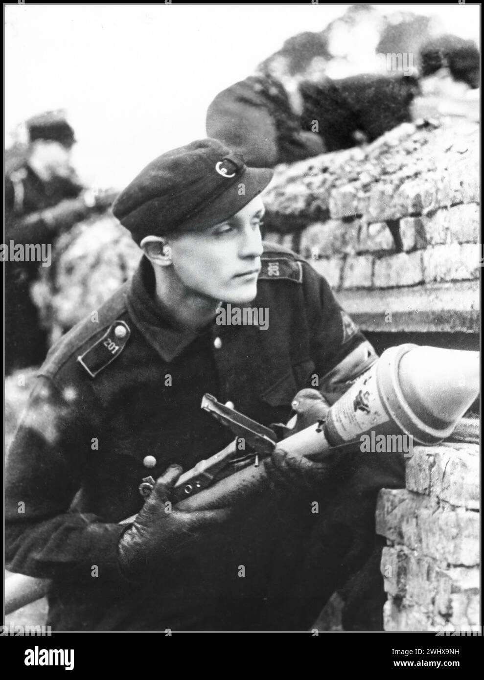 WW2 1945 Berlin VOLKSSTURM peoples army. Adolf Hitlers last gasp defence of Berlin. Uniformed youth holding an anti tank PANZERFAUST weapon to vigorously and bravely defend Nazi Germany against the advancing British Soviet and American forces. 1945 World War II Second World War Berlin Nazi Germany Stock Photo